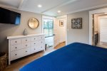 Master bedroom with 40in flatscreen TV and access to bathroom